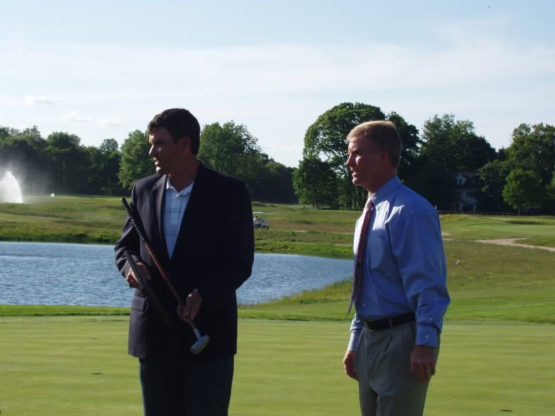 BEN HAYES HOLDS THE REPLICA SCHENECTADY PUTTER WHILE SMILING WITH PRO BOB RITTINGER