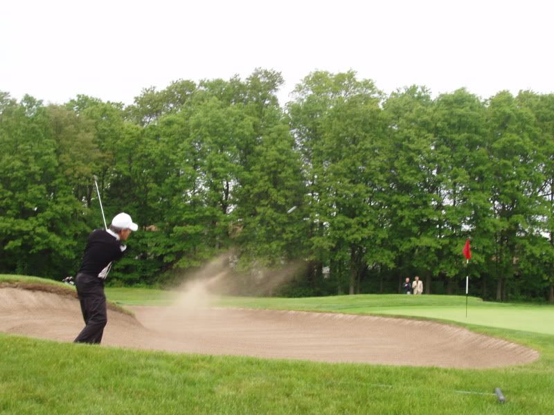 Winner Chris Lange blasts from a bunker on 12 en route to winning the 99th Travis invitational at Garden City Golf Club